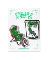 pins of pickle sitting in lawn chair and pickle jar