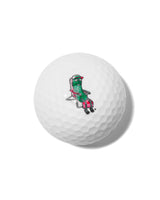 close up of pickle in lounge chair on golf ball