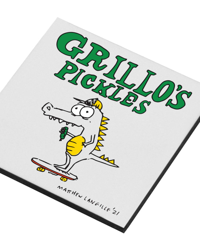close up of grillo's pickles dinosaur magnet 