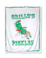 blanket with "grillo's pickles" and pickle in lawn chair on it