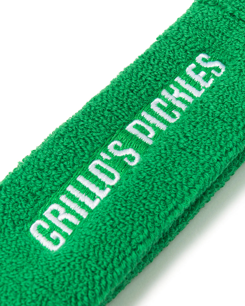 close up of "grillo's pickles" on sweat band