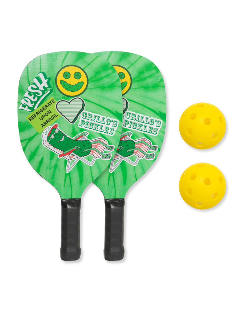 two grillo's pickle pickle ball paddles next to two yellow pickle balls