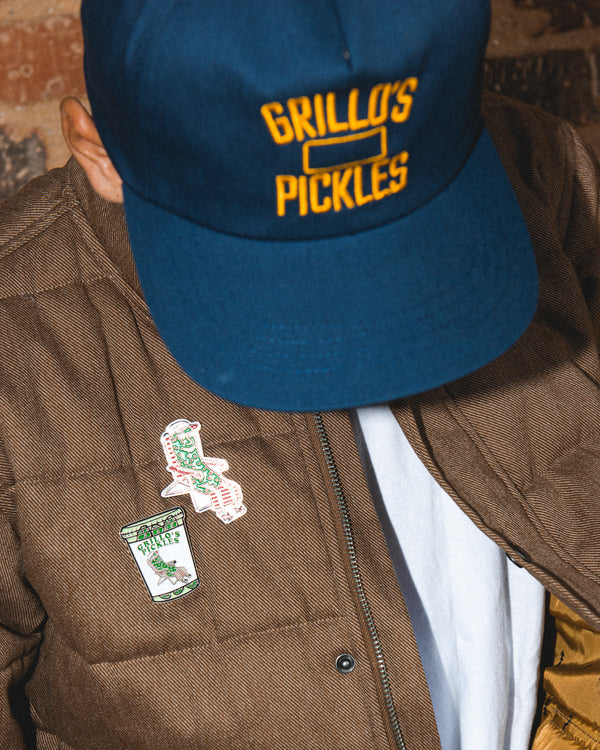 jacket with pickle jar and pickle in lawn chair pins on it